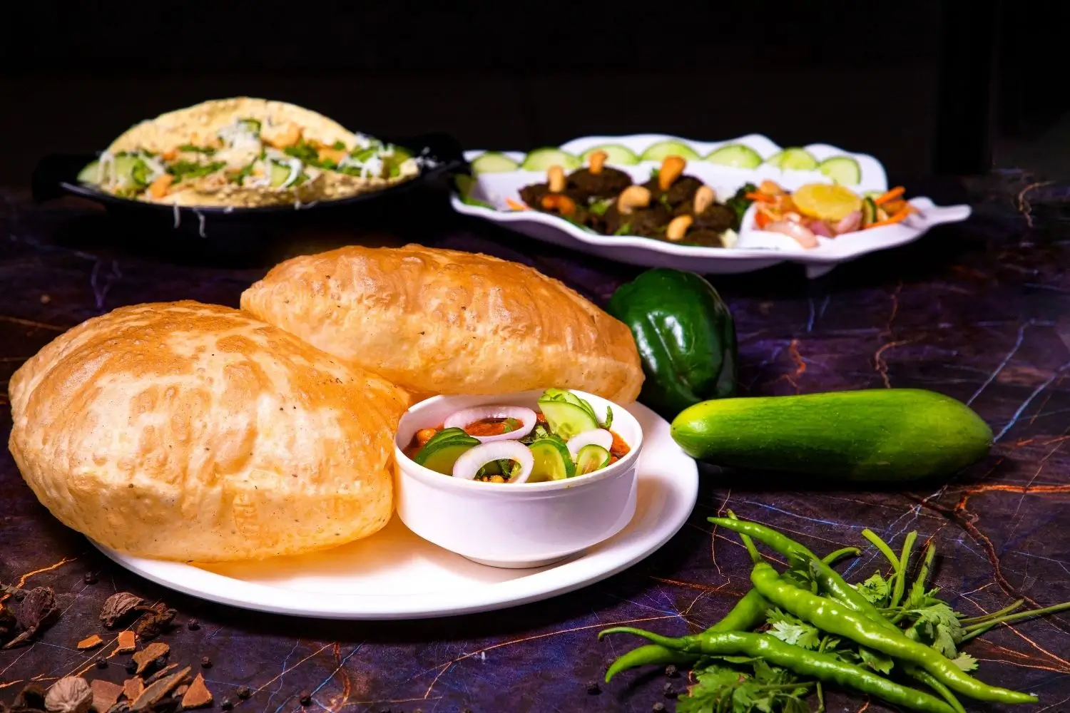  A colorful plate of Chole Bhature, highlighting a variety of traditional Indian dishes.